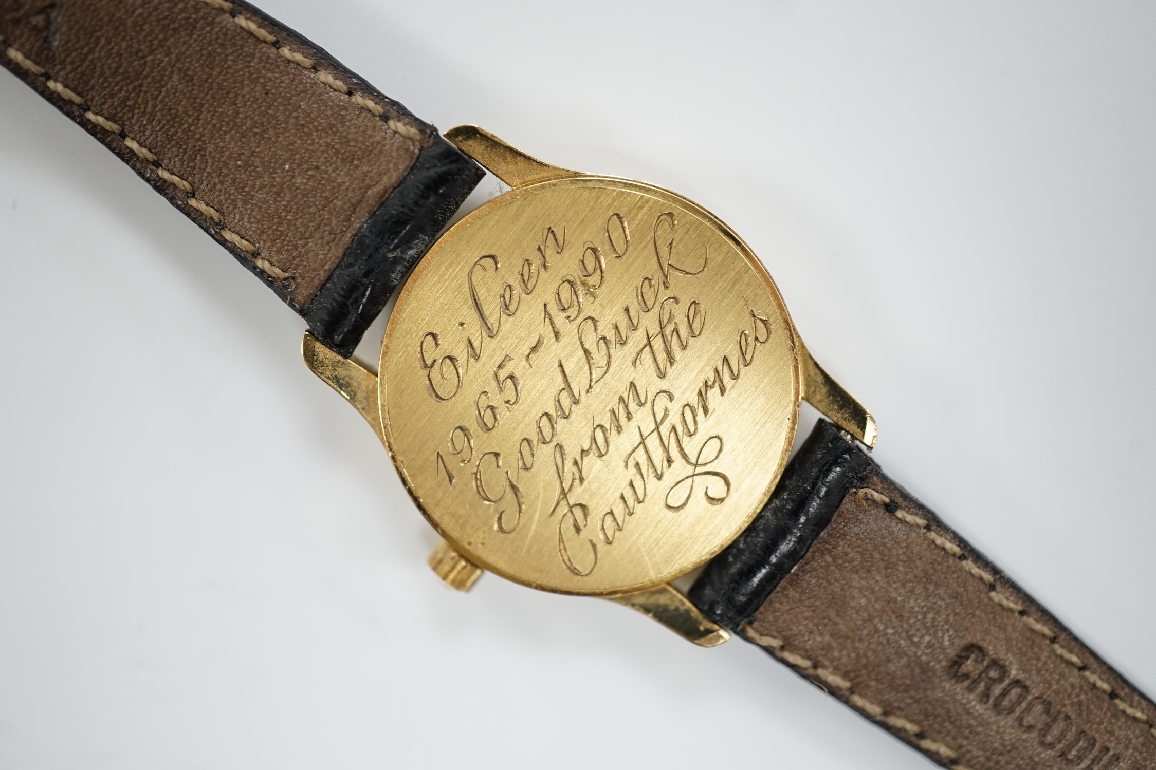 A lady's 18ct gold Omega quartz wrist watch, with case back inscription, on a leather strap with Omega buckle, with Omega box.